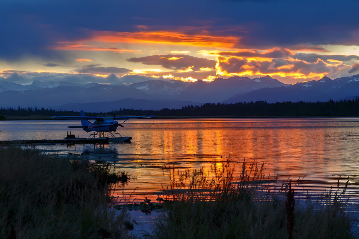 OCUK73122: Tranquil Sunset over Water and Mountains