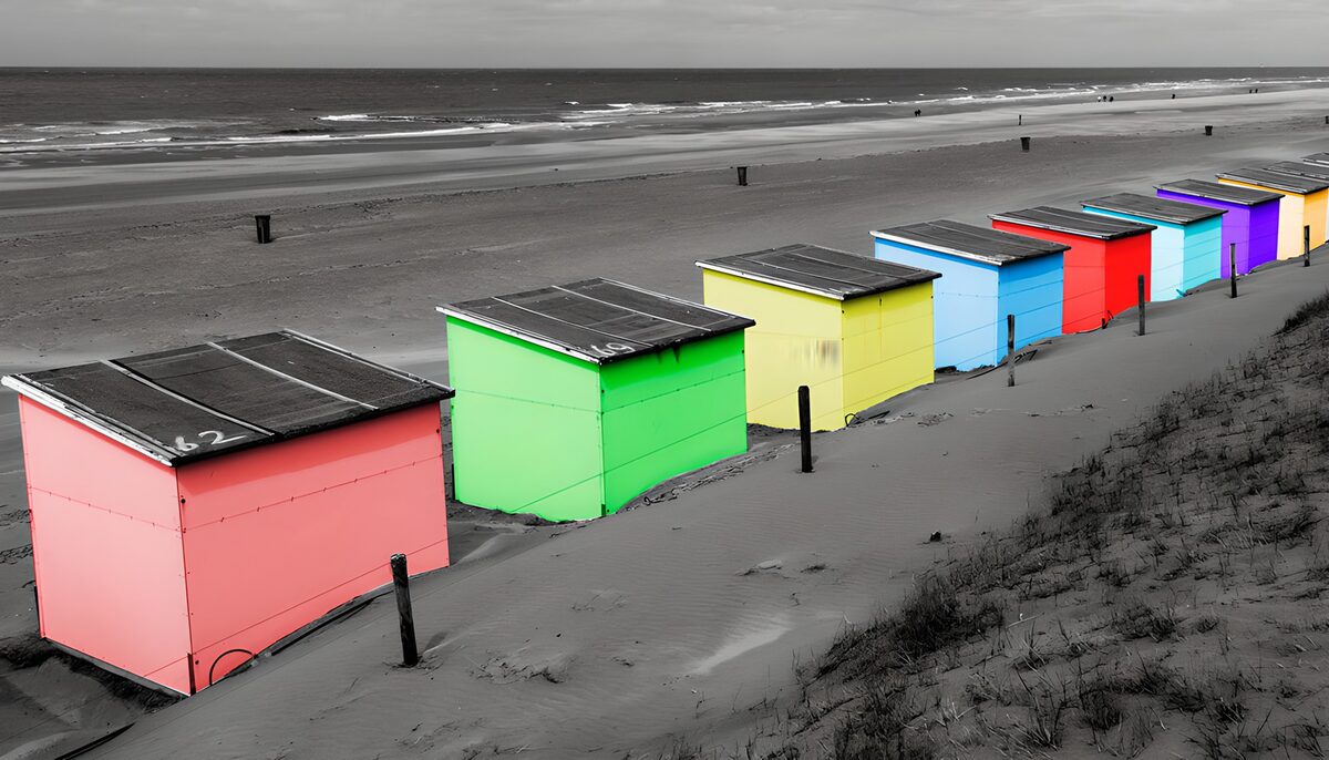 OCUK97023: Colorful Beach Huts on a Monochrome Shore
