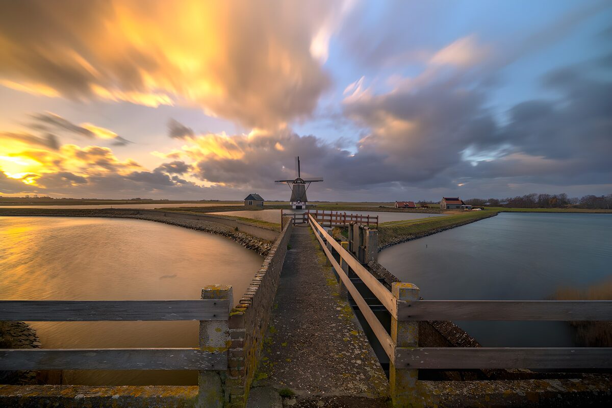 OCUK21127: "Serene Sunset Over Dutch Windmill"