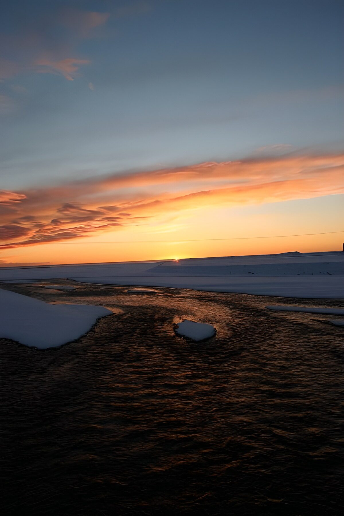 OCUK17263: Serene Sunset over Snowy Landscape