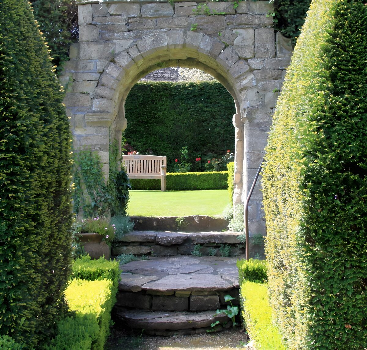 OCUK16265: Arched brick doorway to English garden