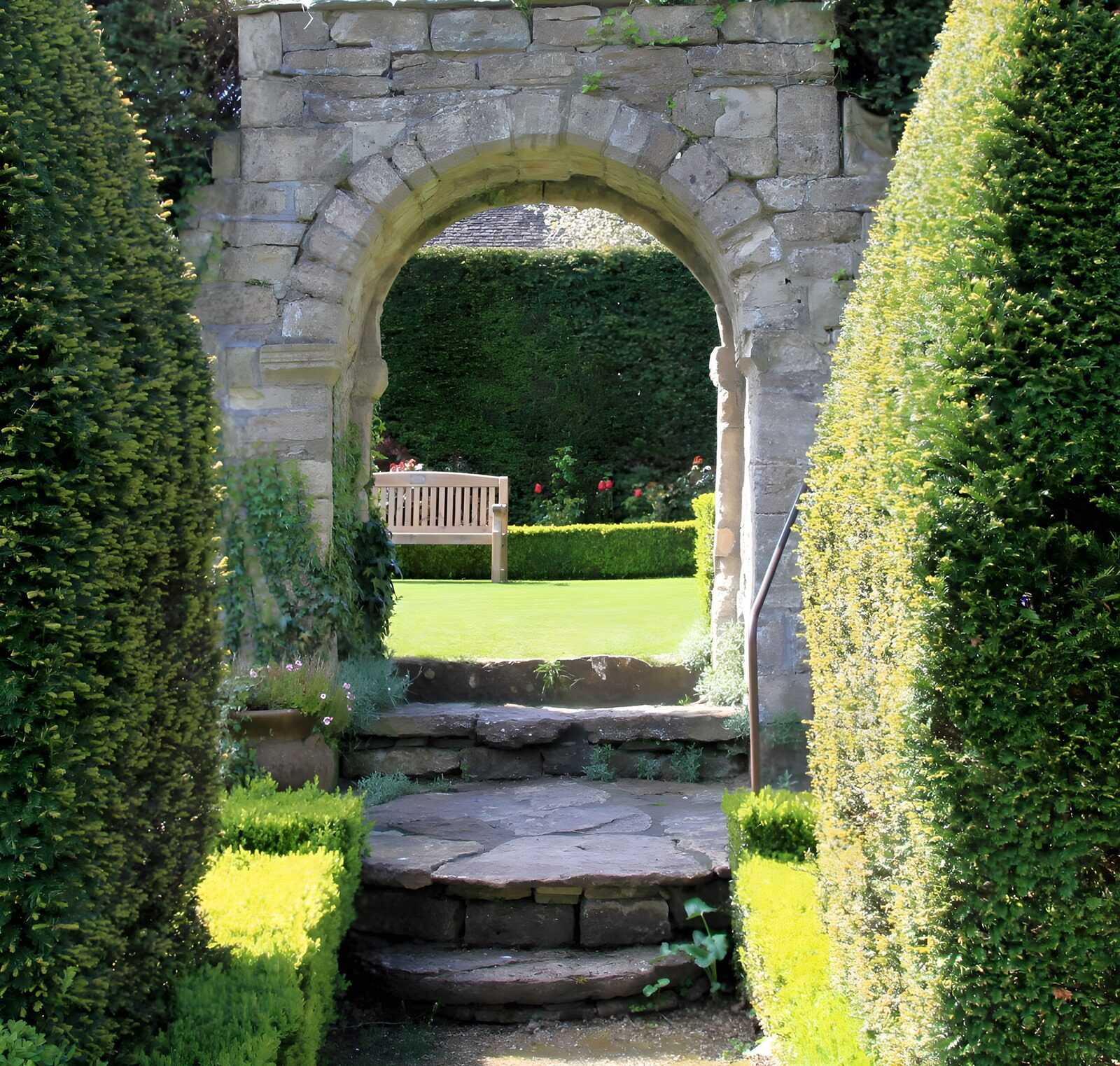 OCUK16265: Arched brick doorway to English garden