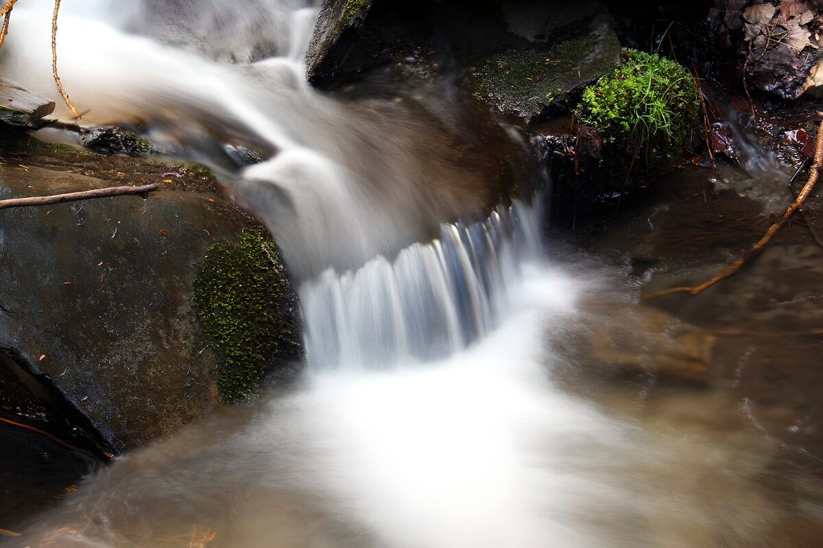 OCUK54869: Gentle Stream Flowing Over Rocks