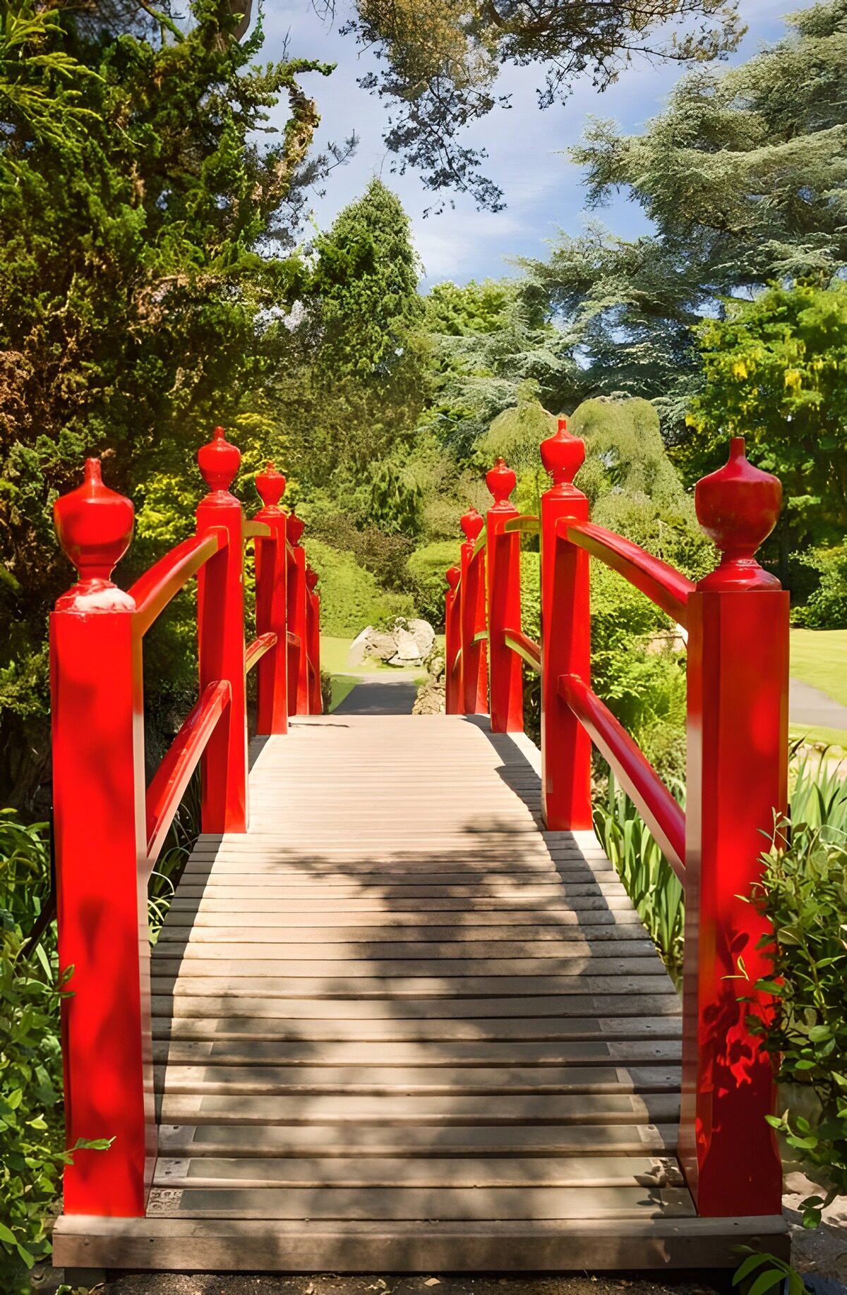OCUK51609: Red Bridge in Lush Garden