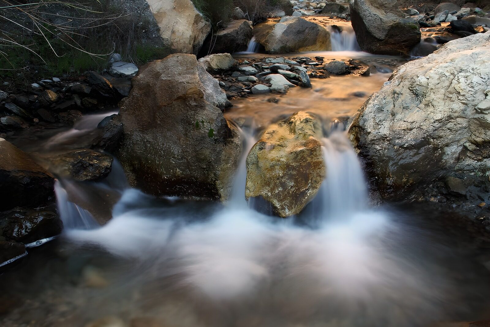 OCUK83977: Tranquil Stream Flowing Over Stones