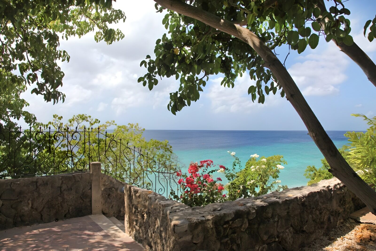 OCUK32677: Caribbean view from balcony with flowers and trees