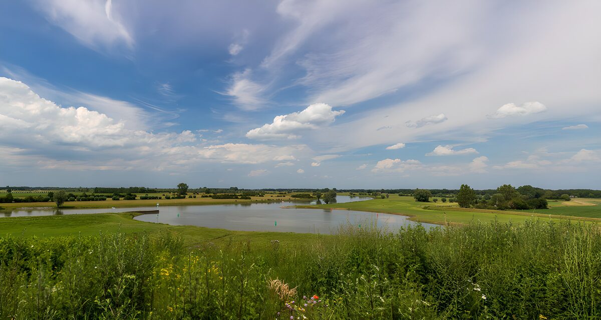 OCUK84160: Serene Landscape with Water and Clouds