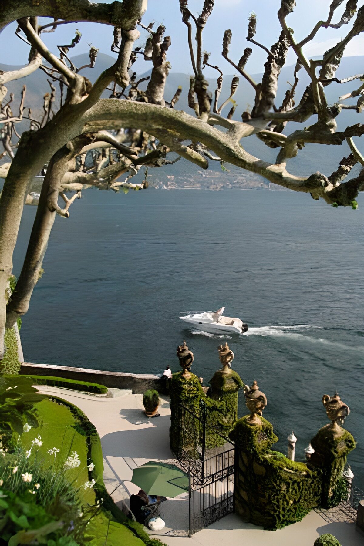 View over lake with a view through trees with speedboat on the water