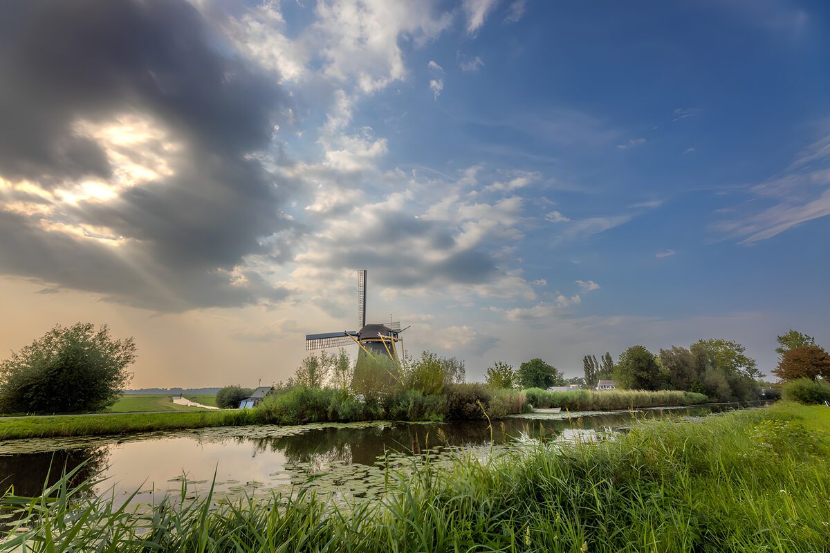 OCUK66813: Tranquil Windmill by the Waterway