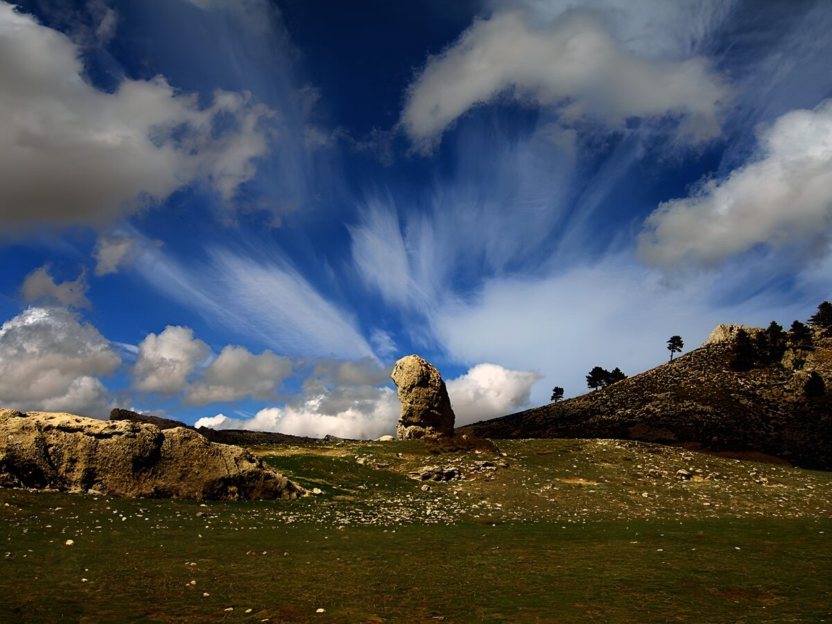 OCUK18930: Majestic Rock Formation Under Vast Skies