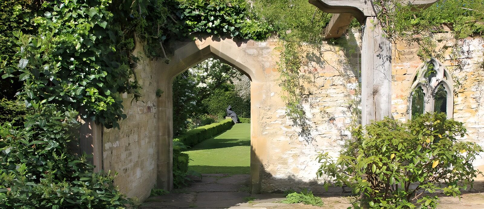 OCUK46239: Old brick wall with a gate at an English garden